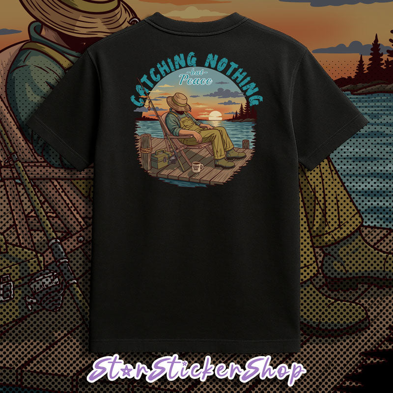 Black fishing graphic tee with peaceful fisherman artwork, lake scenery, and relaxing outdoor vibes.