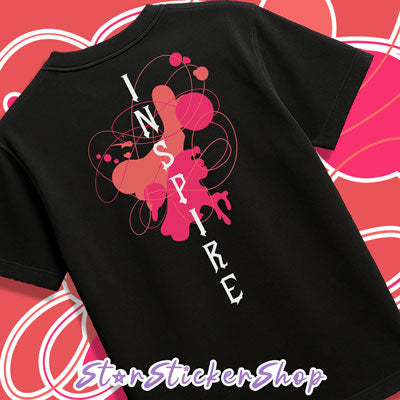 Black t-shirt with 'INSPIRE' design on a pink and white patterned background