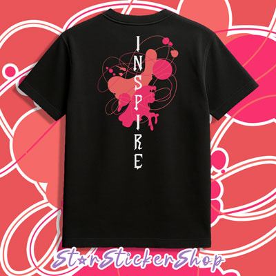 Black t-shirt with 'INSPIRE' design on a pink and white patterned background