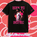 Black t-shirt with 'Born to Inspire' design on a pink and white patterned background